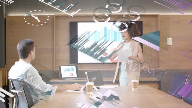 Woman presenting bar charts to business colleague while laptop mirroring slide, AR overlaying both