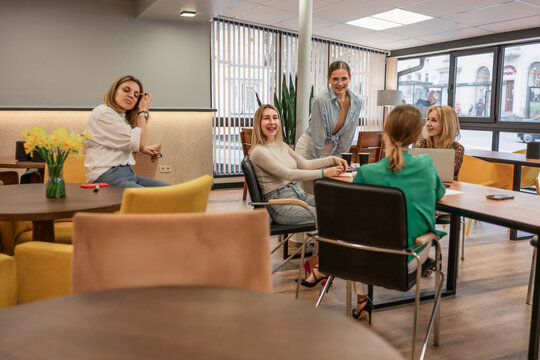 Businesswomen teamwork office meeting joyful collaboration discussion in modern workplace interior