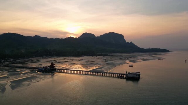 Koh Muk, Thailand: Aerial drone of the jetty in the famous Koh Mook in the Andaman sea in Trang province during a dramatic sunset in southern Thailand. 