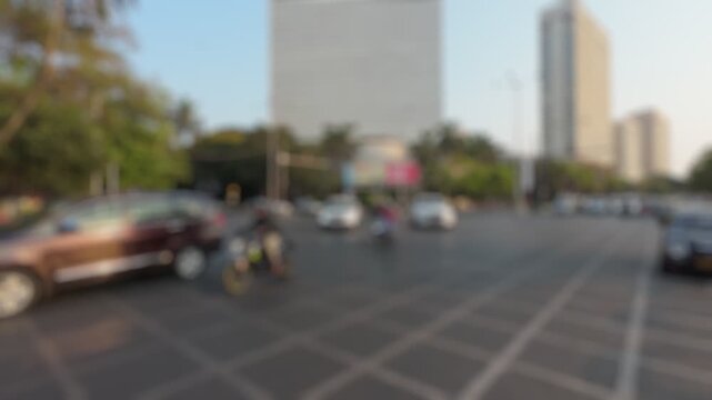 Bokeh view of road traffic at Netaji Subhash Chandra Bose Road (Marine drive) in Mumbai, India. Blurred background footage.