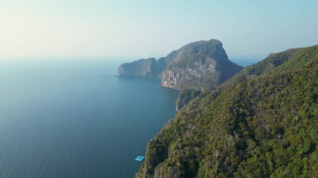 Koh Muk, Thailand: Aerial drone of the dramatic coastline in the famous Koh Muk, or Mook island in the Andaman sea in Trang in Thailand. Shot with a cinematic revealing motion above the jungle