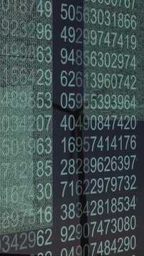 Vertical video: Projected digits shifting while camera panning, revealing columns and pole for tech