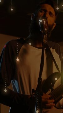 Vertical video: Music singer playing, stepping to mic and singing to move, animated stars floating