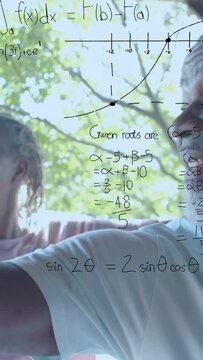 Vertical video: Senior couple holding phone and capturing memory, math graphs animating over faces