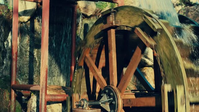 Serene Historic Waterwheel Turning Gracefully in Natural Landscape