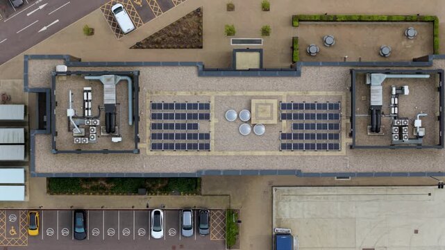 Top down aerial view of industrial rooftop ventilation systems, showcasing complex HVAC infrastructure and air handling units.