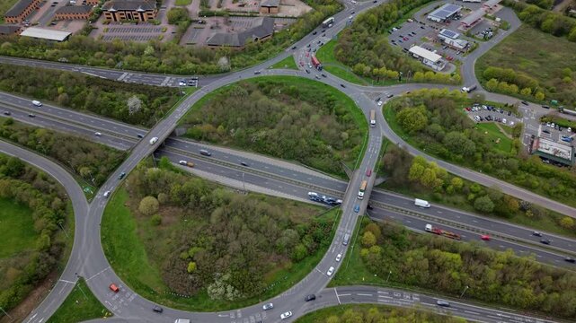 Top down aerial view of heavy traffic at Flagstaff Island roundabout near Ashby-de-la-Zouch UK