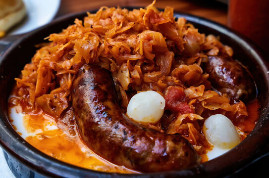 Delicious traditional Polish bigos stew with sausage in a bowl