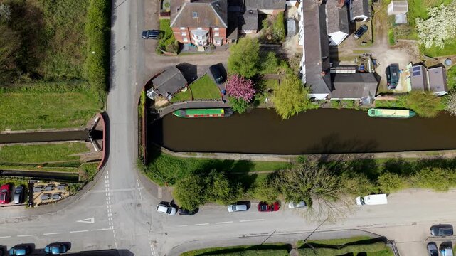 Top down aerial view of narrowboats on the Trent and Mersey Canal at Barton Marina UK