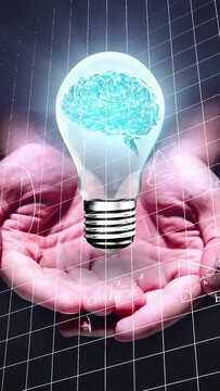 Vertical video: Entering, cupped hands with dark sleeve lifting bulb on grid, showing brain concept