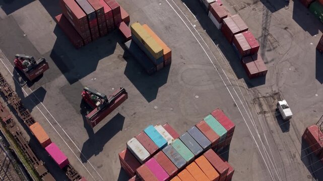 Shipping Container Yard Aerial View: An aerial perspective showcases a bustling shipping container yard.