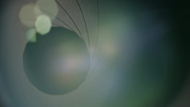 Camera lens with lense reflections and movement of the internal shutter , close-up