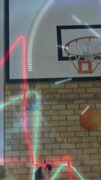 Diverse students, coach watching Chinese teen dunking basketball in school gym with neon overlay