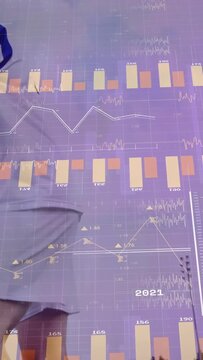 Male soccer player tracking incoming ball, heading to redirect upward, chart overlay covering frame