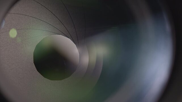 Camera lens with lense reflections and movement of the internal shutter , close-up