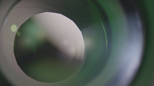 Camera lens with lense reflections and movement of the internal shutter , close-up