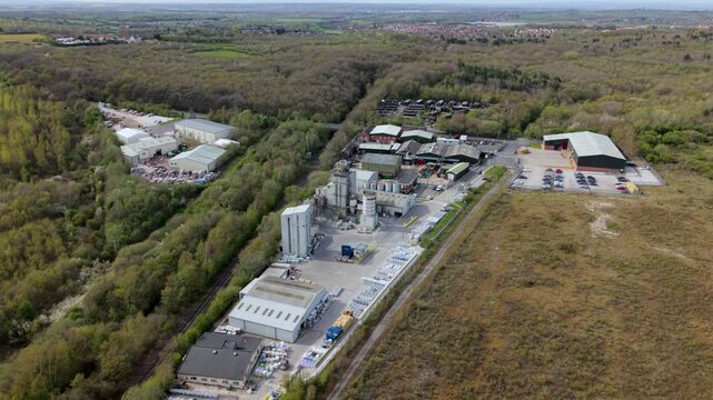 Aerial drone view of a massive brick and concrete manufacturing plant in Swadlincote UK