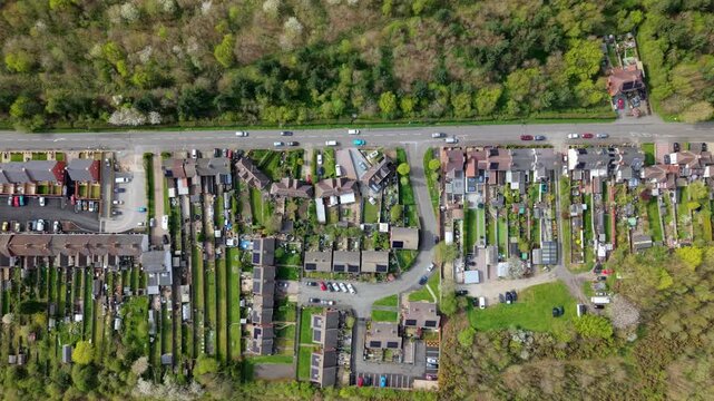 Top down aerial view of residential houses and forest in Albert Village UK