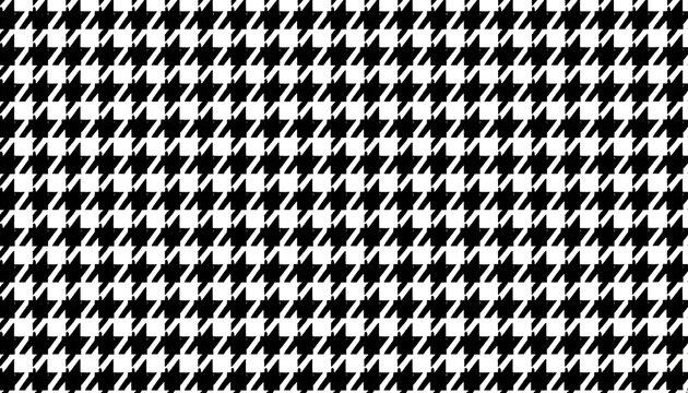 A classic and timeless black and white houndstooth pattern provides a sophisticated textile background.