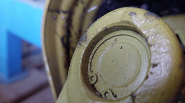 Rotating PTO drive shaft on agricultural machinery close up