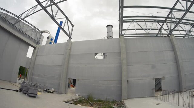 Warehouse interior construction with steel beams, structure, and unfinished industrial space