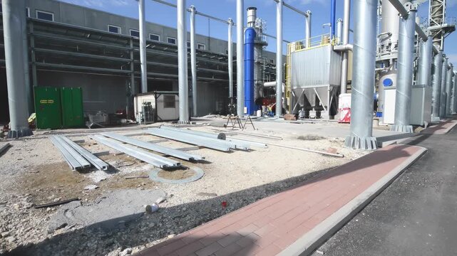 Industrial building site showing structural elements and framework during construction phase