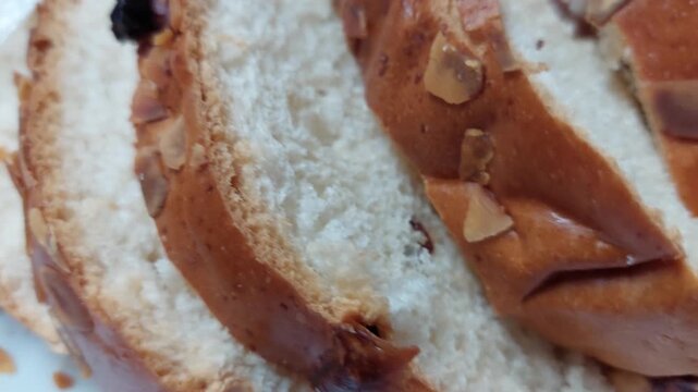 Close up of sliced traditional Czech Easter sweet bread Mazanec with almonds