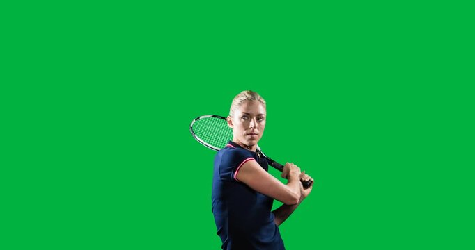 Caucasian female badminton player holding a racket against black background