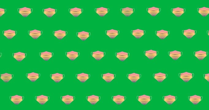 Digital animation of multiple printed face mask icons in seamless pattern against black background