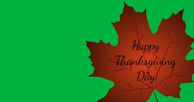 Digital animation of happy thanksgiving text on autumn maple leaf against black background