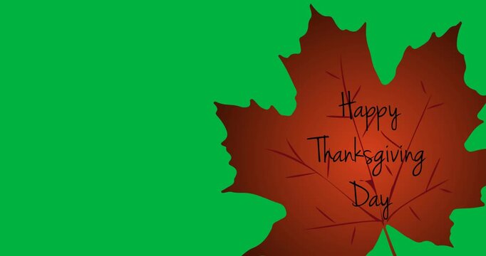 Digital animation of happy thanksgiving text on autumn maple leaf against black background