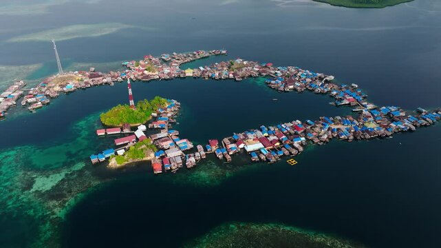 Aerial Drone Shot of Remote Ocean Village &ndash; Kepulauan Kabalutan Togean Island Indonesia