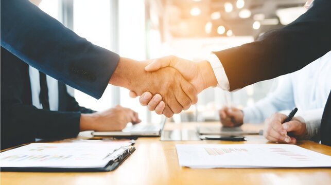 Diplomacy negotiation teamwork professional exchanging ideas across desk no faces visible corporate environment balanced lighting