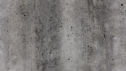 Rough Textured Grey Concrete Wall Background with Dark Stains and Small Holes © yashis007