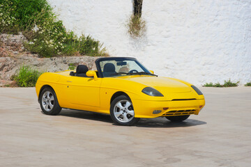 Yellow convertible sports car - Italian design © Gherzak