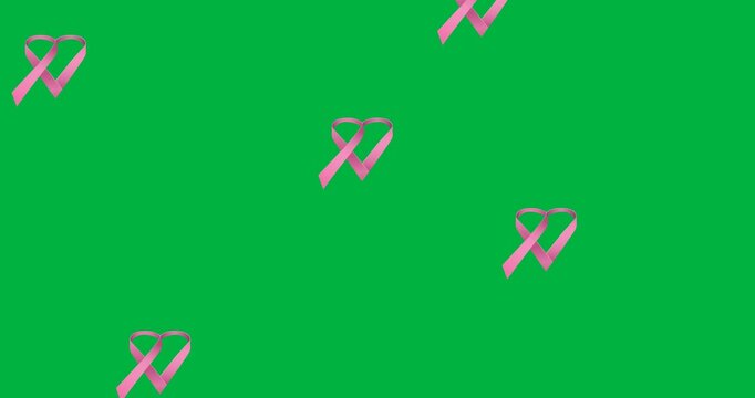 Digital animation of multiple pink ribbon heart icons falling against black background