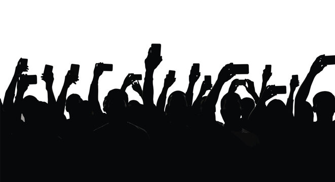 Silhouetted crowd of people holding up their smartphones recording a live event or taking photos.