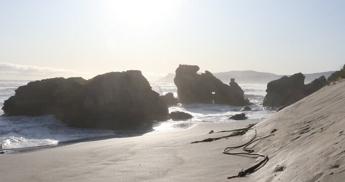 teenage girl overlooking beautiful rocky coastline, Sopies Klip, Hermanus, South Africa