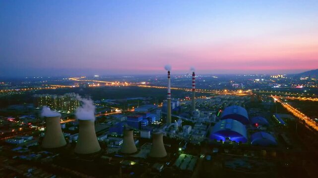 Aerial view of a 220 kV thermal power plant at night in Hohhot, Inner Mongolia, China.