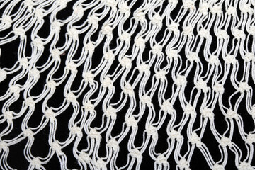 Obraz premium Close up of vintage lace fabric white on black background embroidery
