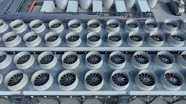 top down view of a bank of chilling tower fans at a AI datacenter with some chilling fans active and others idle as the data center is starting to come online