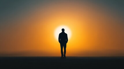 Fototapeta premium Silhouette of a Man Standing Against a Vibrant Sunset with Warm Hues in the Sky, Evoking Feelings of Solitude and Reflection in the Evening Light
