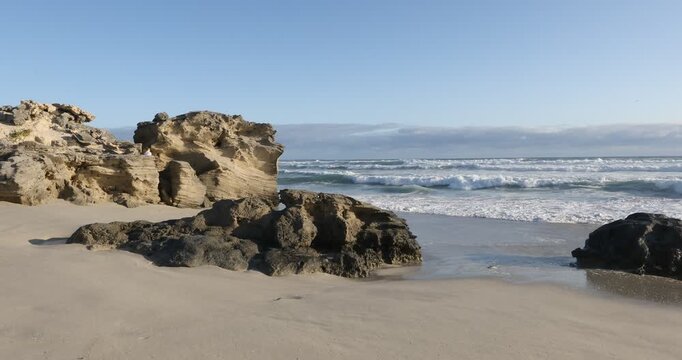 teenage girl overlooking beautiful rocky coastline, Sopies Klip, Hermanus, South Africa