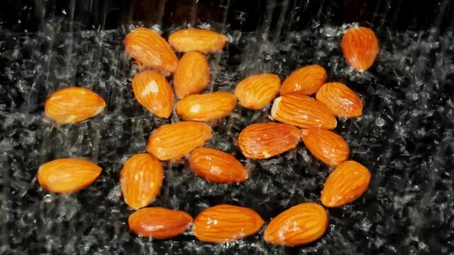 slow motion shows almonds soaking in water with clear steps and details to follow