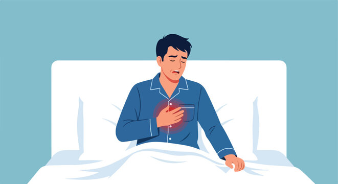 A man in pajamas sits in bed clutching his chest in pain from a heart attack