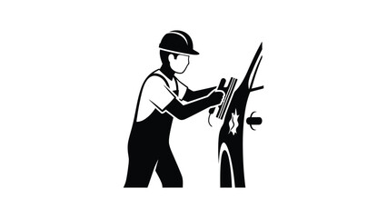 Fototapeta premium Worker in overalls and safety helmet operating a machine.
