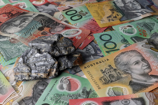 Antimony mine, mining, production in Australia. Stibnite ore piece(s) isolated on Australian Dollar currency, money, notes. Investment, financial stock market, Australian Securities Exchange