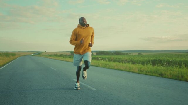 Jogging at sunrise, Sunrise running scene showcasing enthusiastic athlete with vibrant surroundings and casual apparel