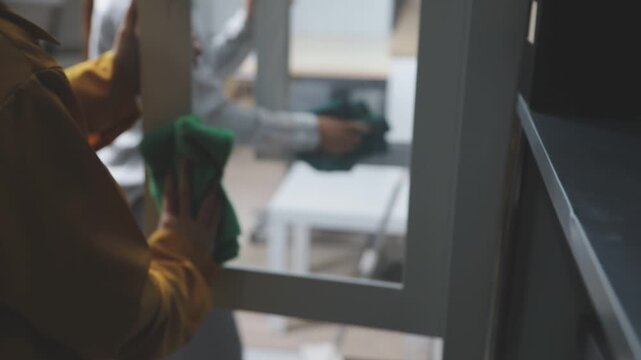 Cleaning company diligently cleans up room two women posing with smiles. Professionalism dedication exemplify importance of regular cleaning services ensuring cleanliness hygiene cleaning company