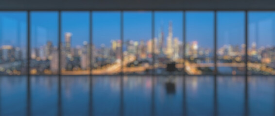 Fototapeta premium Panoramic Night Cityscape View Through Modern Glass Window.